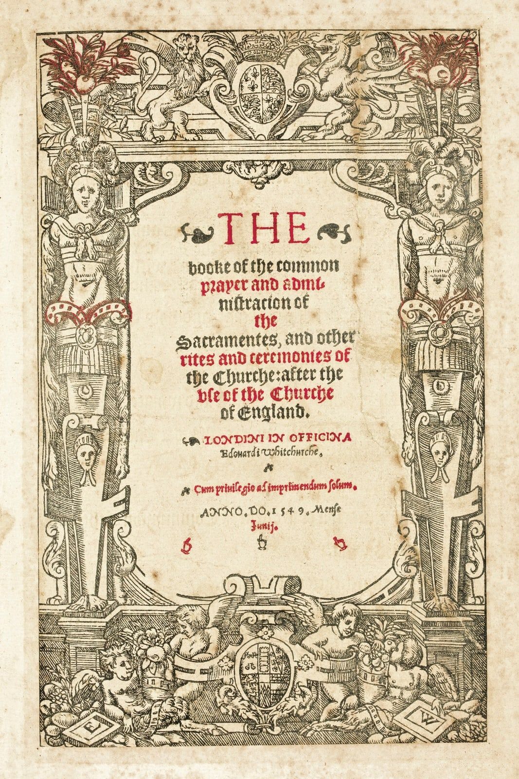 Title page of the first Book of Common Prayer, 1549, printed in red and black inside a woodcut border.