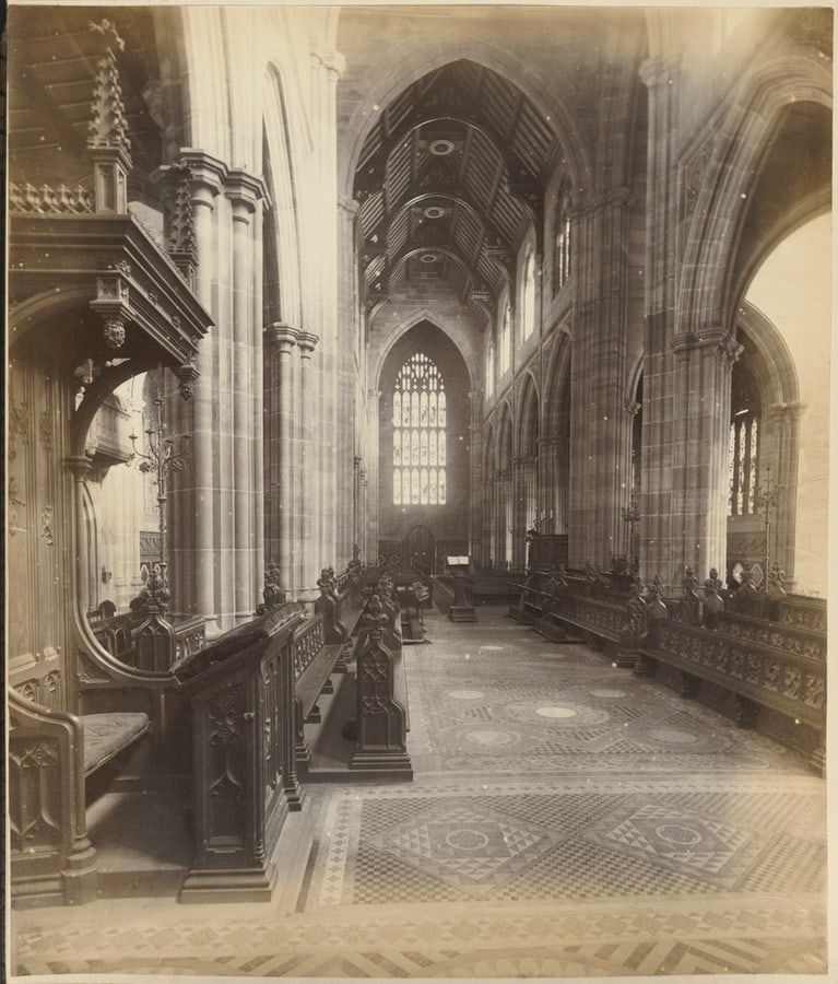 Black-and-white photograph of the nave of St Andrew’s Cathedral, Sydney, in 1879, with a carved pulpit and a patterned tiled floor.